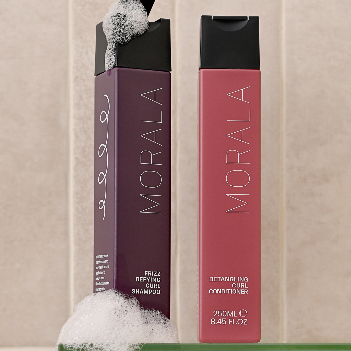 Lathering shampoo and detangling conditioner, a curlies bathroom staples on washday